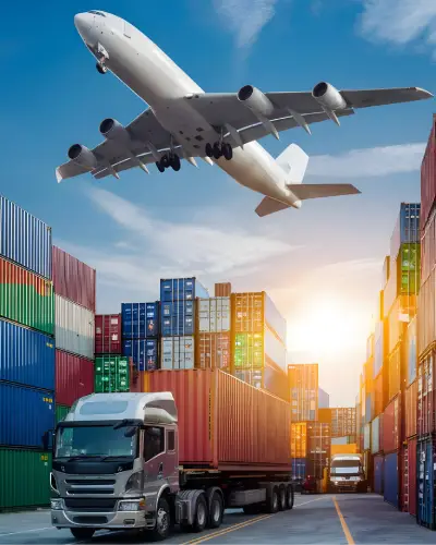 Cargo plane, truck, and shipping containers at a freight terminal